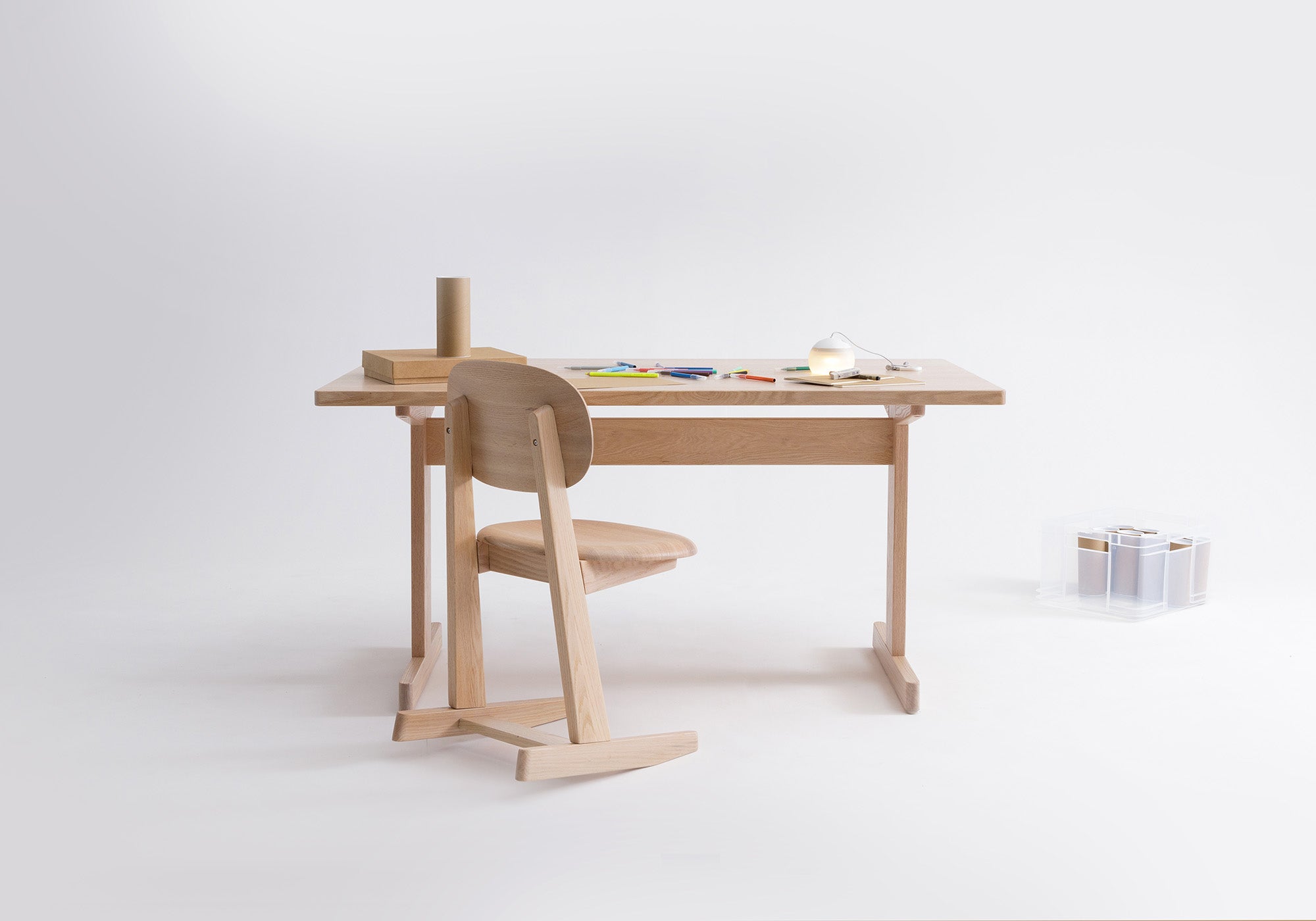 Minimalist Kufenkarl 2-position office chair and table, designed for versatility in home, office, dining, and lounge settings.