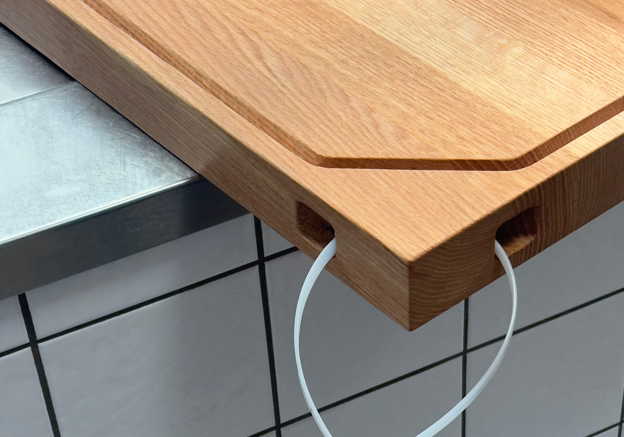 Chef using a wooden cutting board, emphasizing hygiene considerations.