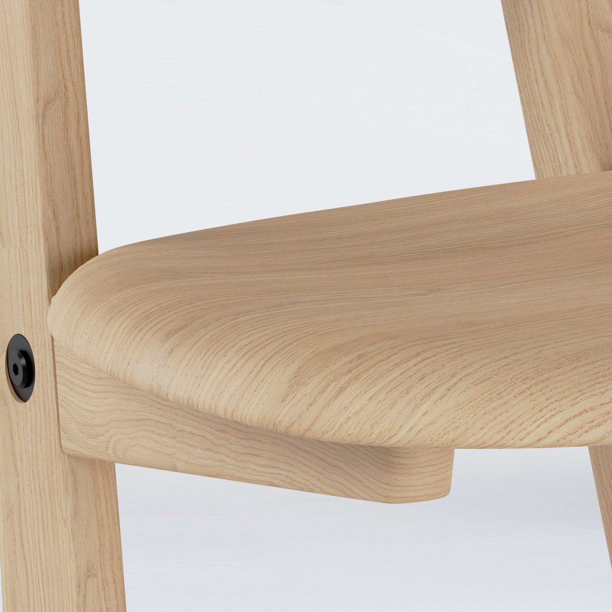 Close-up of KufenKarl Office Tipforward KD in Oak Nature with black frame – highlighting fine woodworking details and precision engineering.