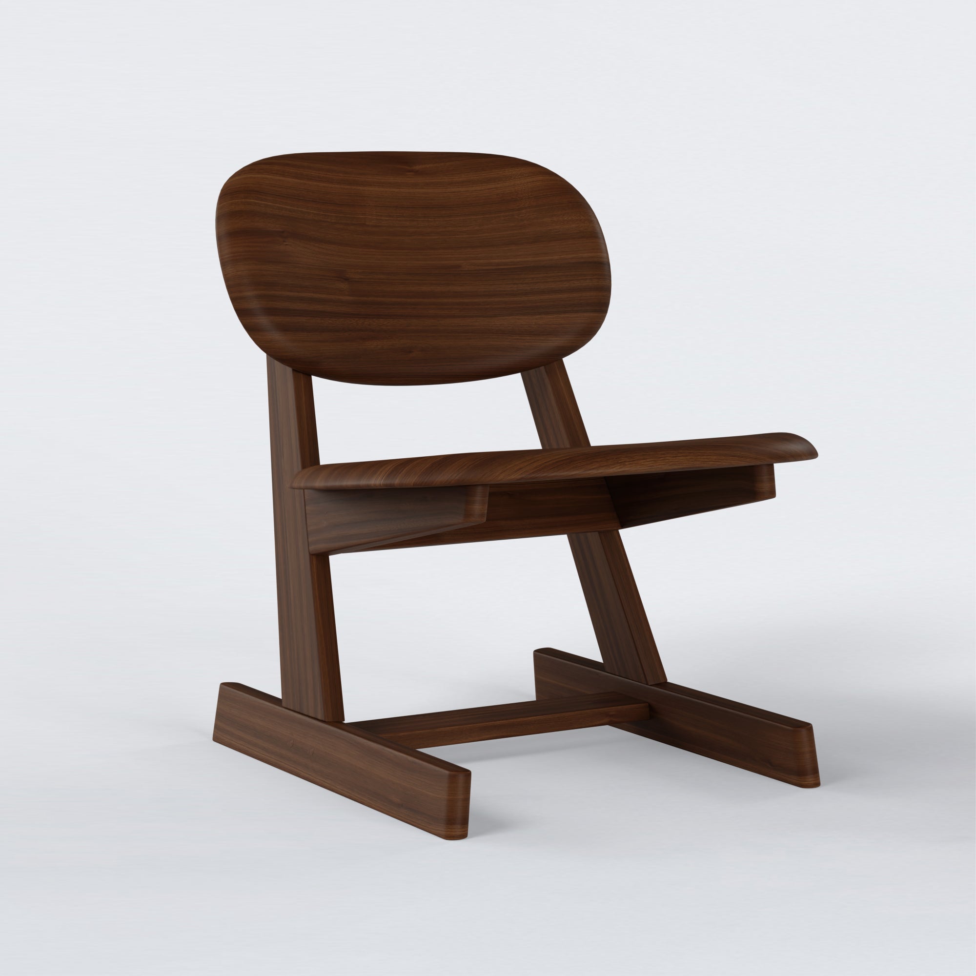 KufenKarl Lounge Chair in walnut dark – angled side view, showcasing the refined contours of the frame.