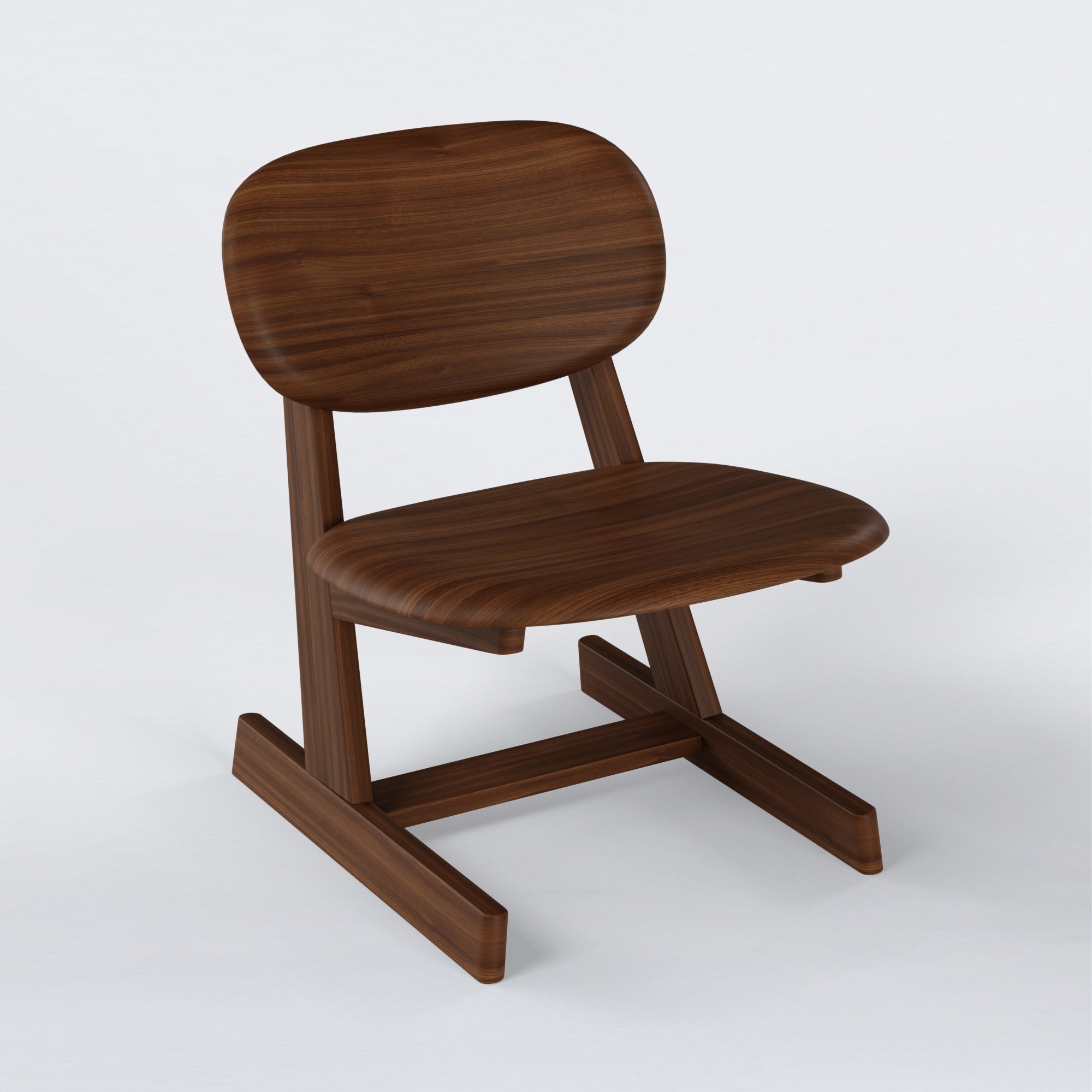 KufenKarl Lounge Chair in walnut dark – three-quarter view, emphasizing depth and rich wood tones.