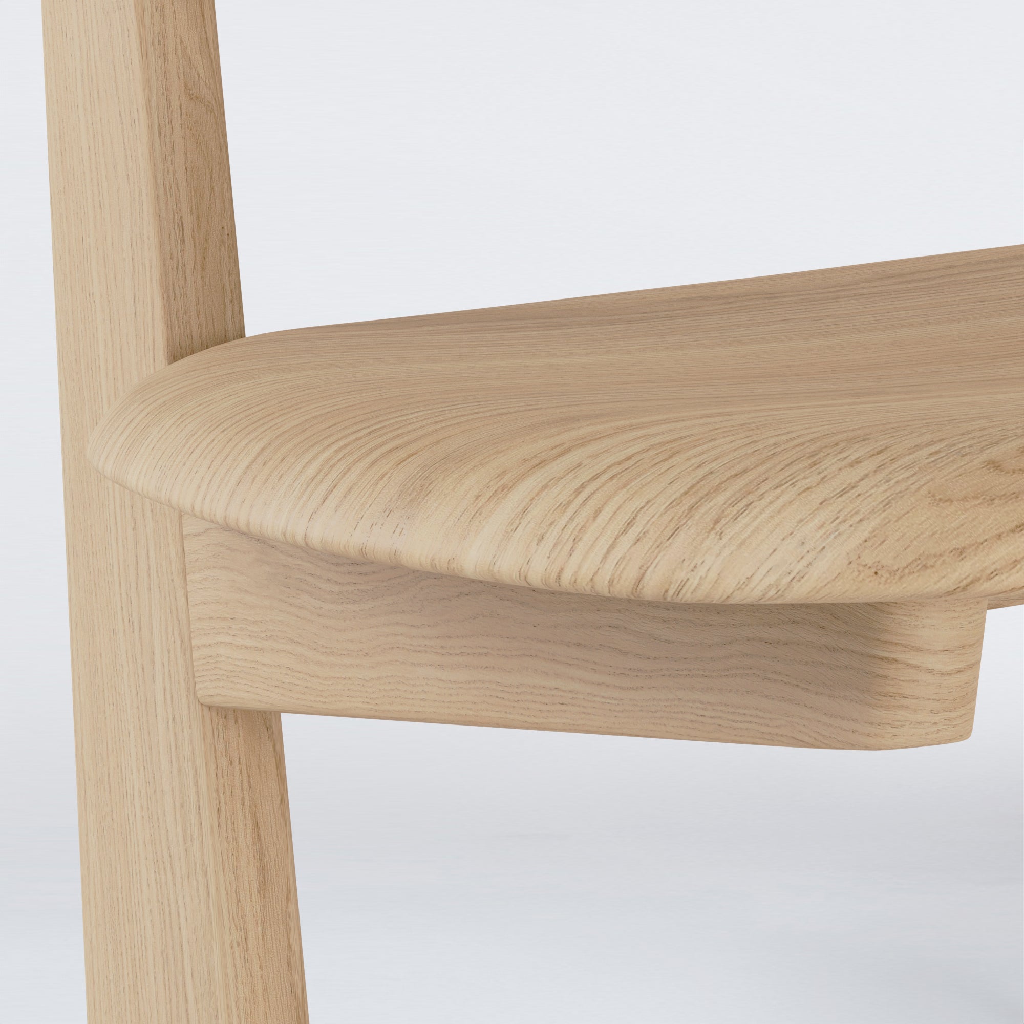 Close-up of KufenKarl Lounge Chair in natural oak, emphasizing the precision craftsmanship and wood grain.