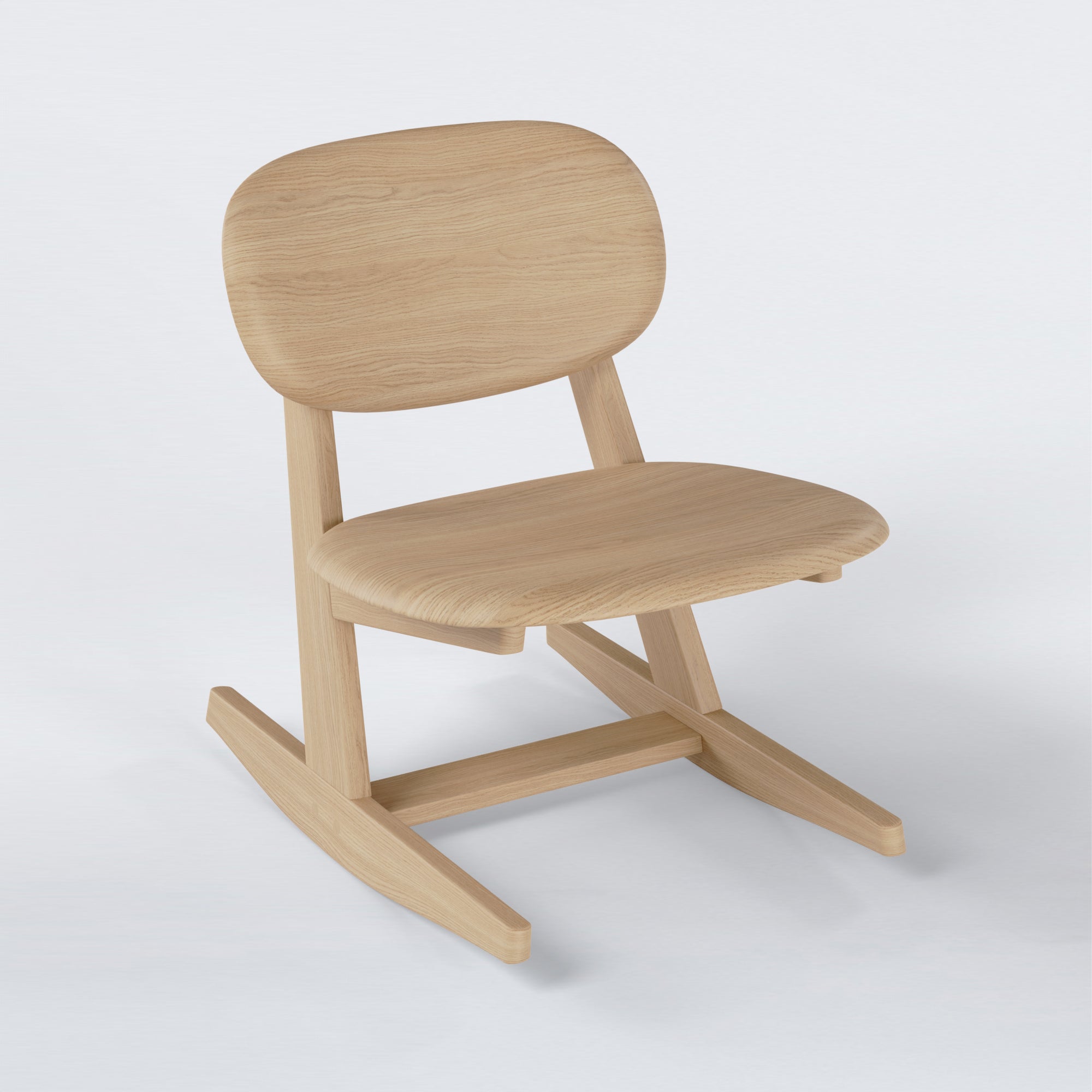 KufenKarl Rocking Chair in natural oak – three-quarter view, illustrating its seamless curves and contemporary design.