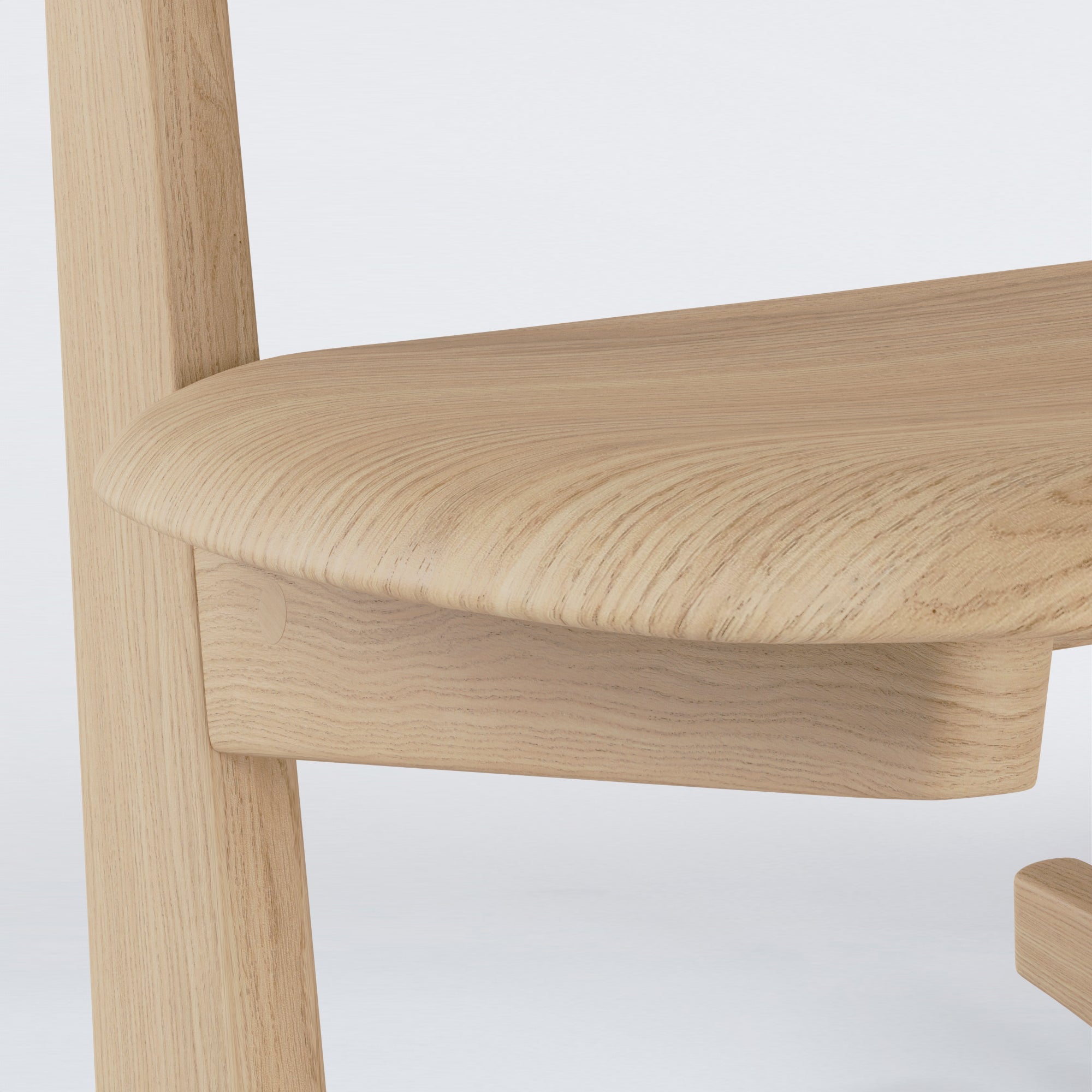 Close-up of KufenKarl Rocking Chair in natural oak, showcasing precision joinery and material beauty.