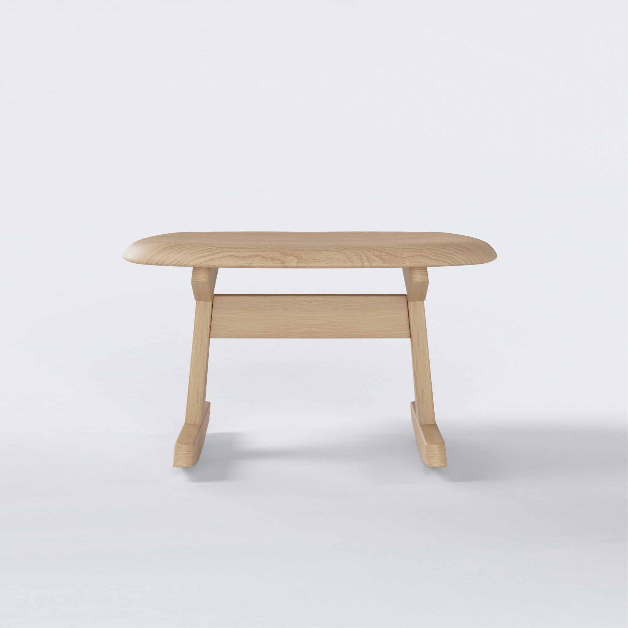 KufenKarl Rocking Ottoman in natural oak – front view, offering a light wood alternative with the same contemporary design.