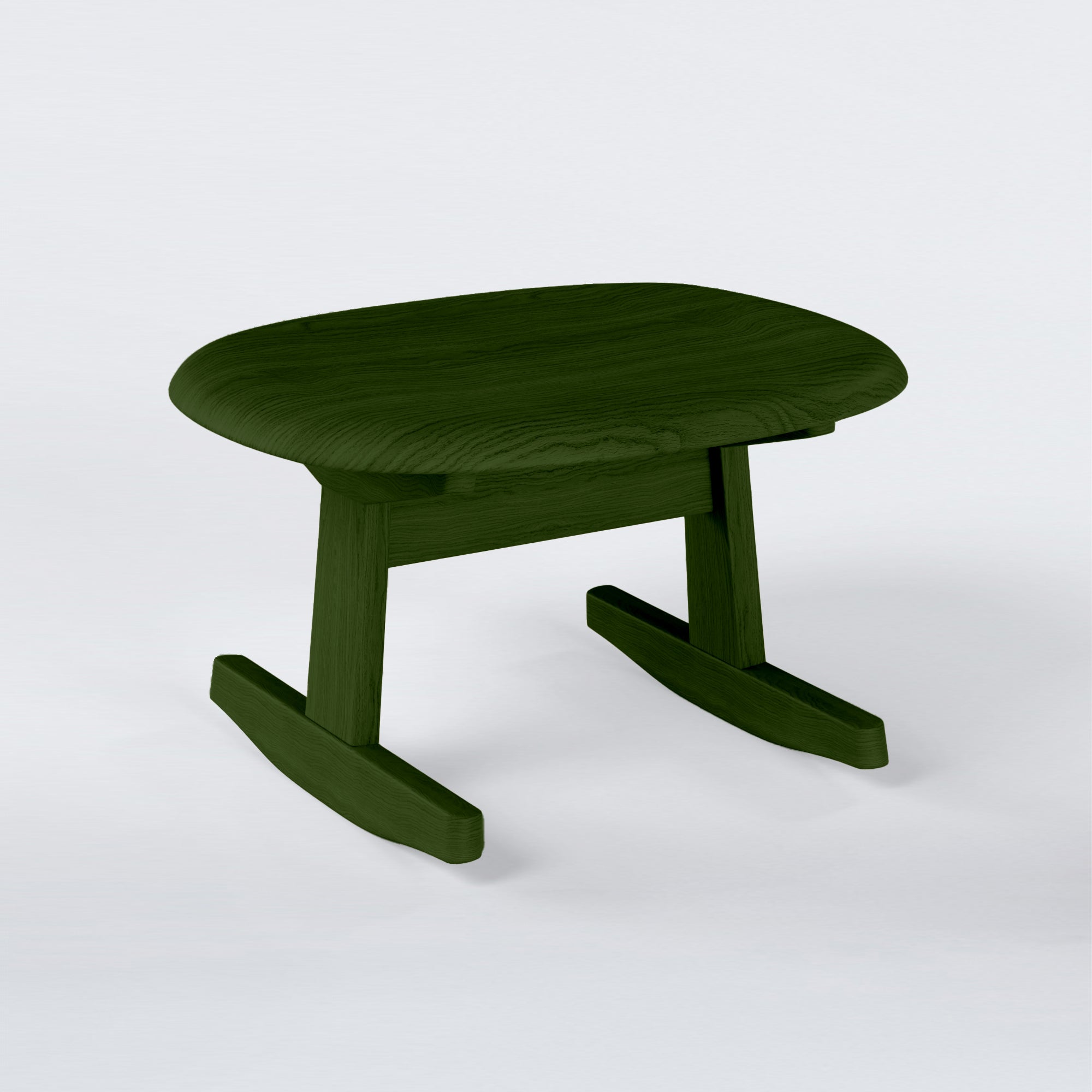KufenKarl Rocking Ottoman in dark green stained oak – deep earthy tone, blending nature with modern design.