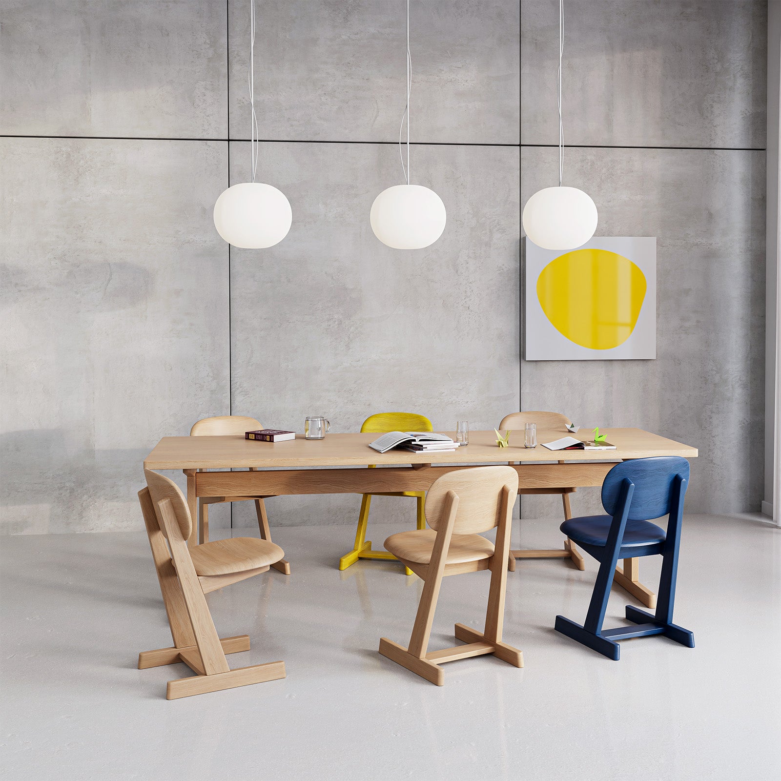KufenKarl dining setup featuring natural oak and painted chairs in a contemporary setting. A balance of function, comfort, and style.