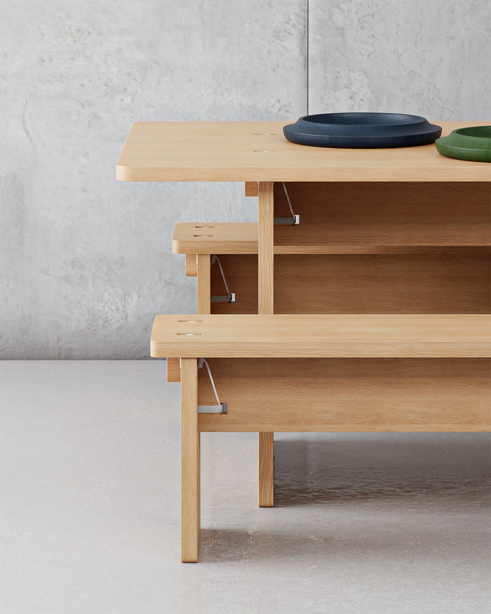 Side view of BO_ Collection table and benches, showcasing their structured, flat-pack design with secure cable-tie construction