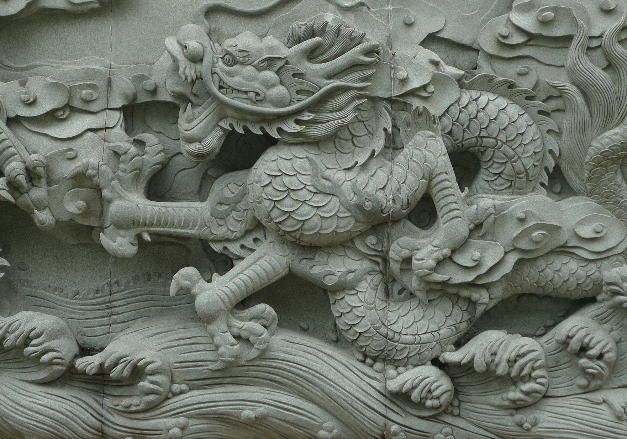 Intricately carved dragon relief, showcasing traditional Chinese craftsmanship and symbolic artistry.