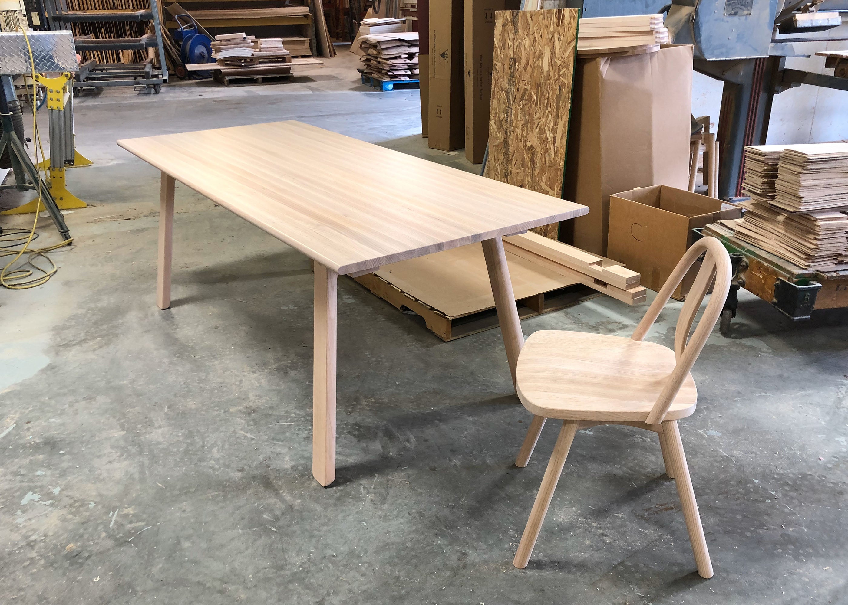T&B table displayed in sample configuration on Collect Studio's workshop floor.