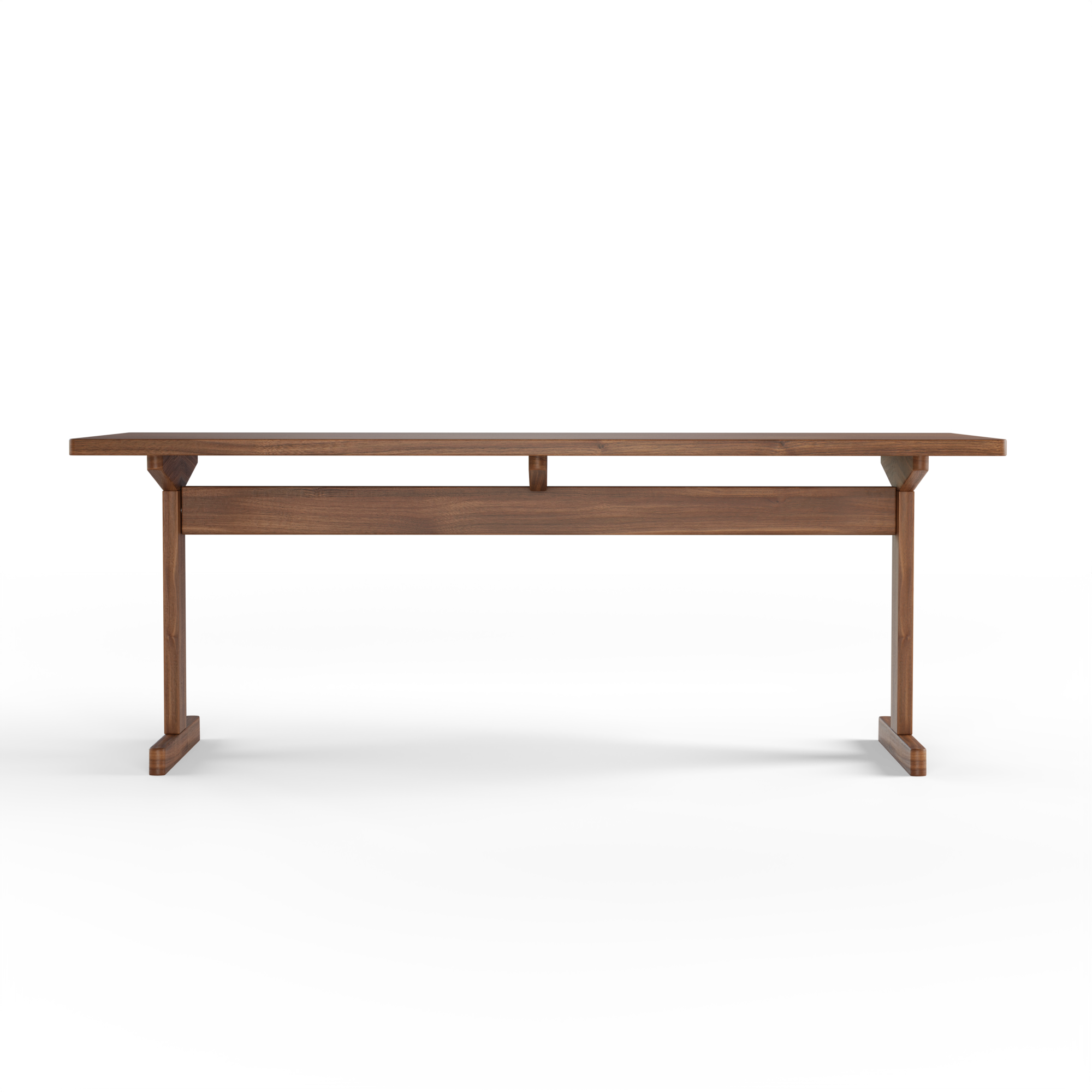 KufenKarl Table in walnut – front view, highlighting its structural integrity and balance.
