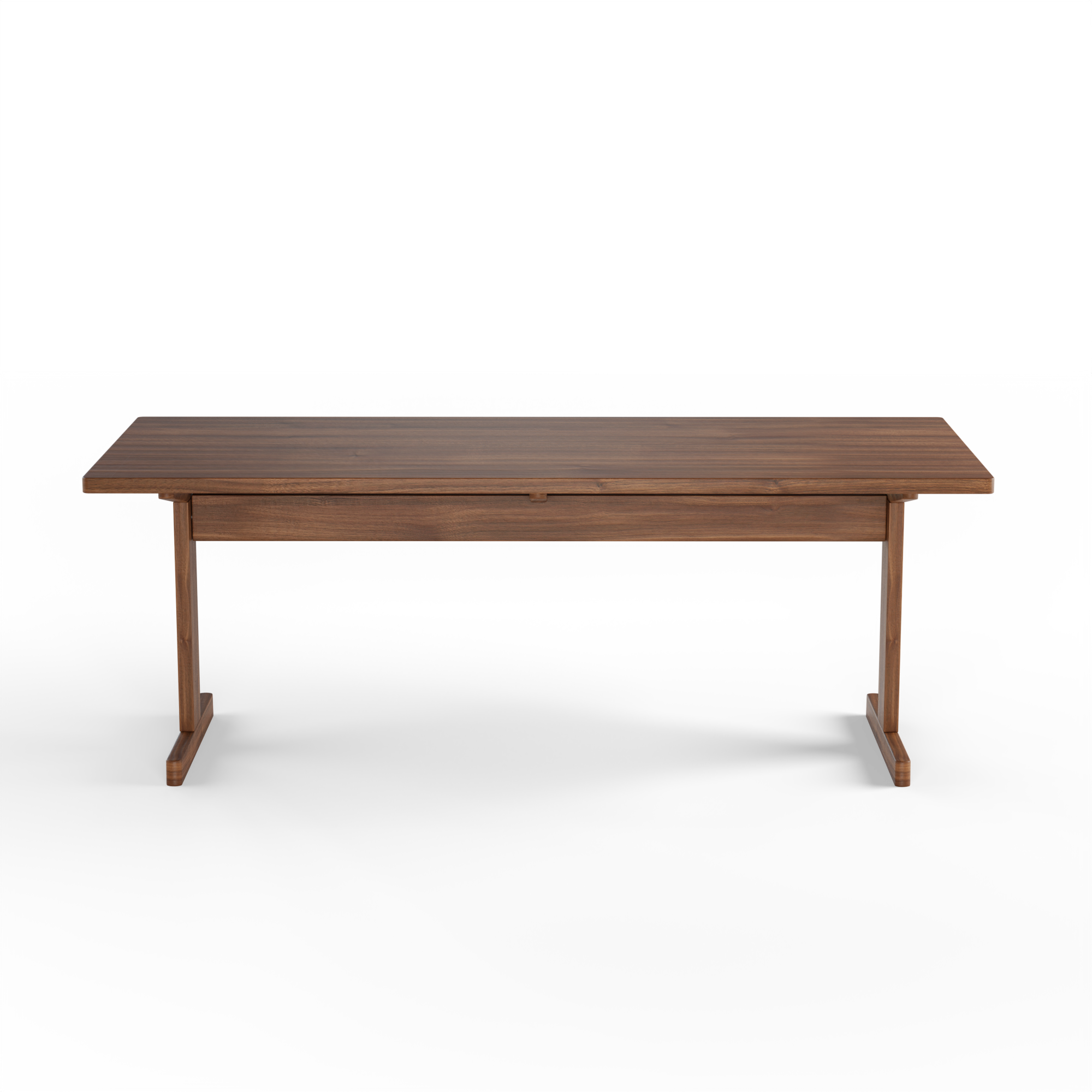 KufenKarl Table in walnut – side profile, showcasing the deep wood tone and craftsmanship.
